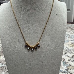 Elegant Gold Necklace with Blue Accents